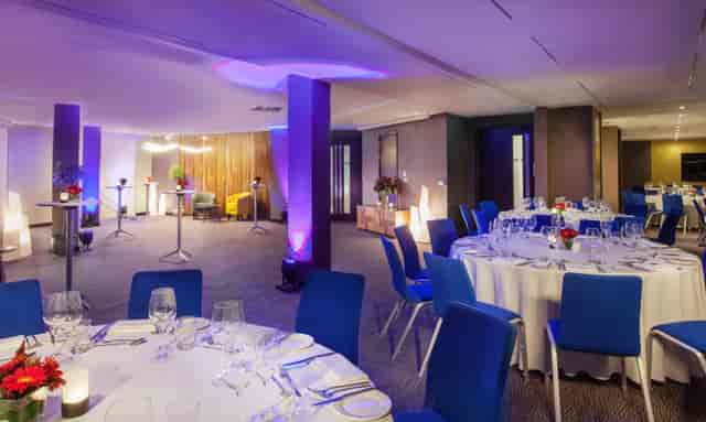 Elegant event space with round tables, perfect for corporate functions and galas.
