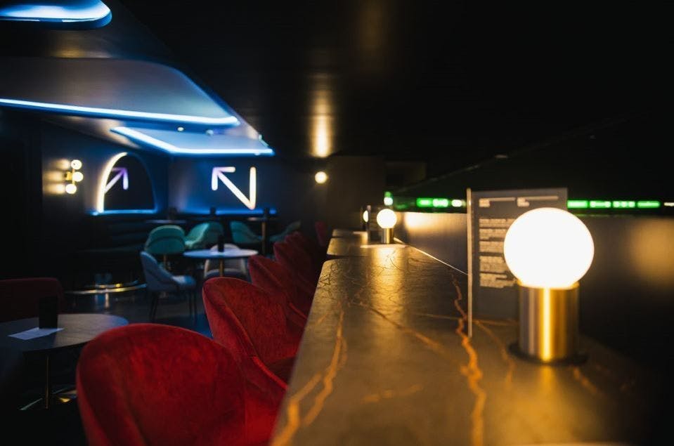 Luxury Suites at AO Arena with modern decor, ideal for networking and social events.