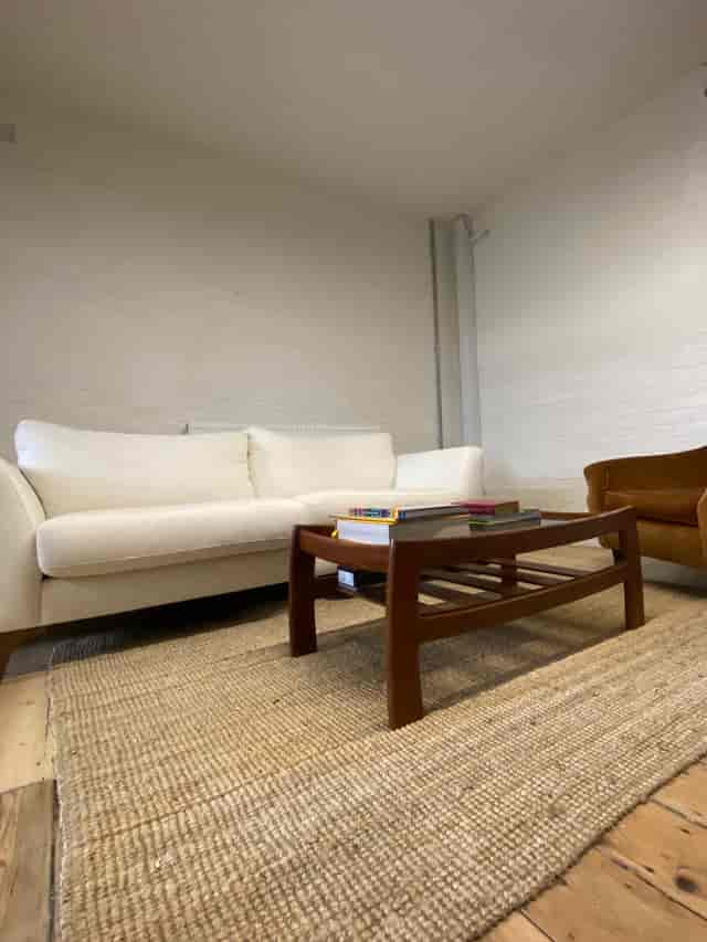 Cozy seating area in Open X Space, ideal for informal meetings and collaboration.