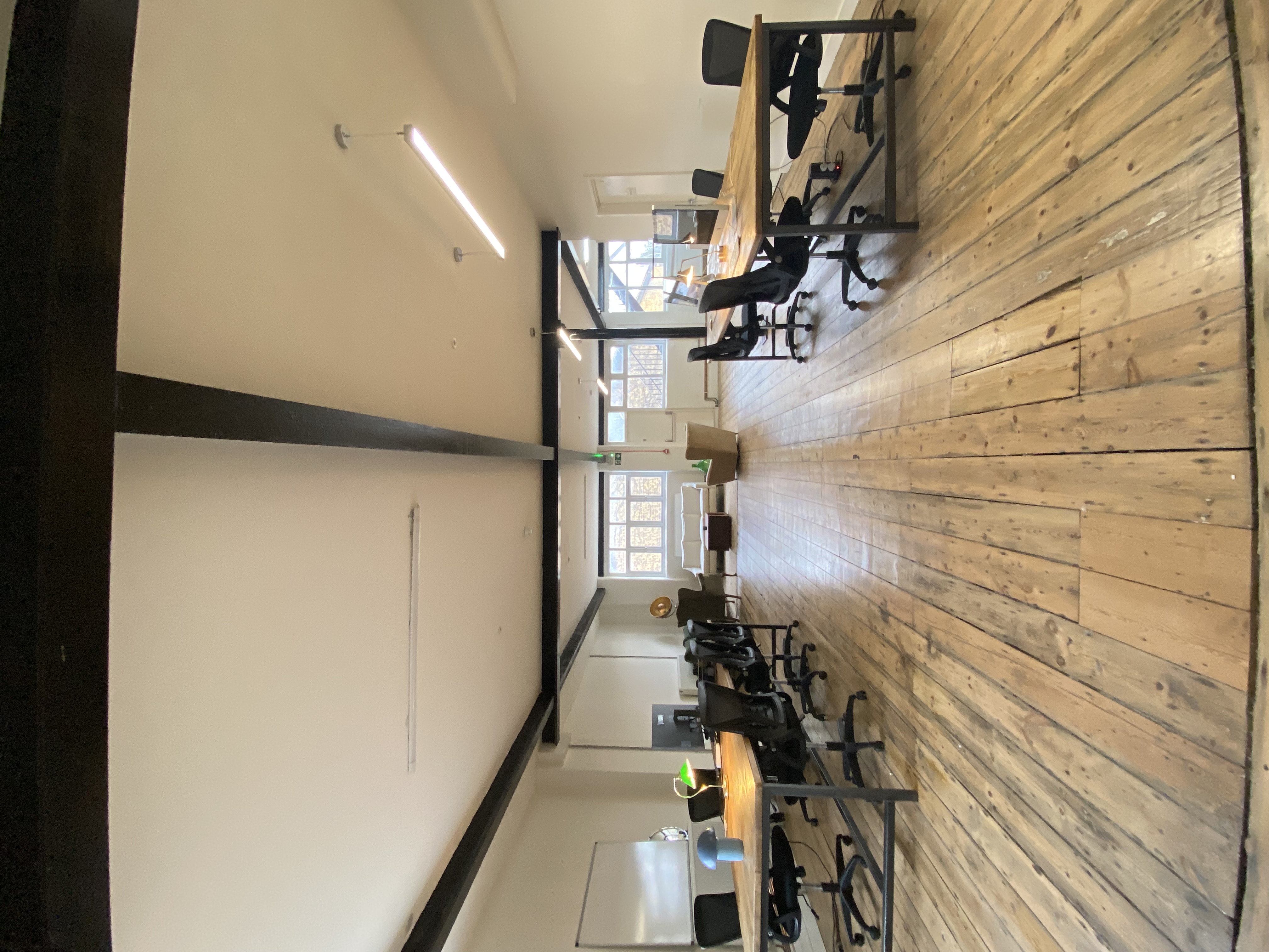 Spacious, well-lit office in Open X Space for meetings and workshops. - Banner