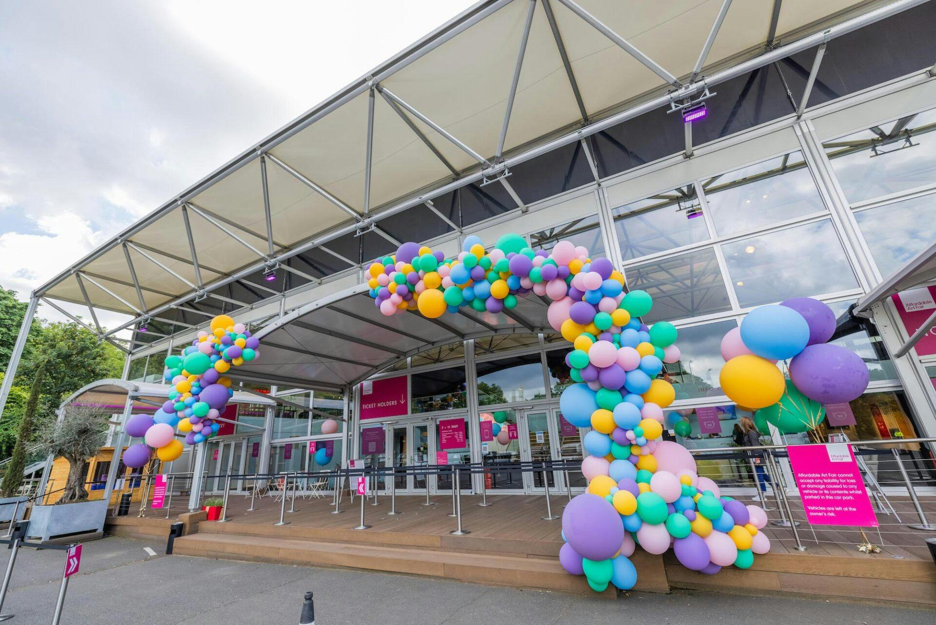 Colorful balloon arch at Summer Events in Evolution London, inviting festive atmosphere.