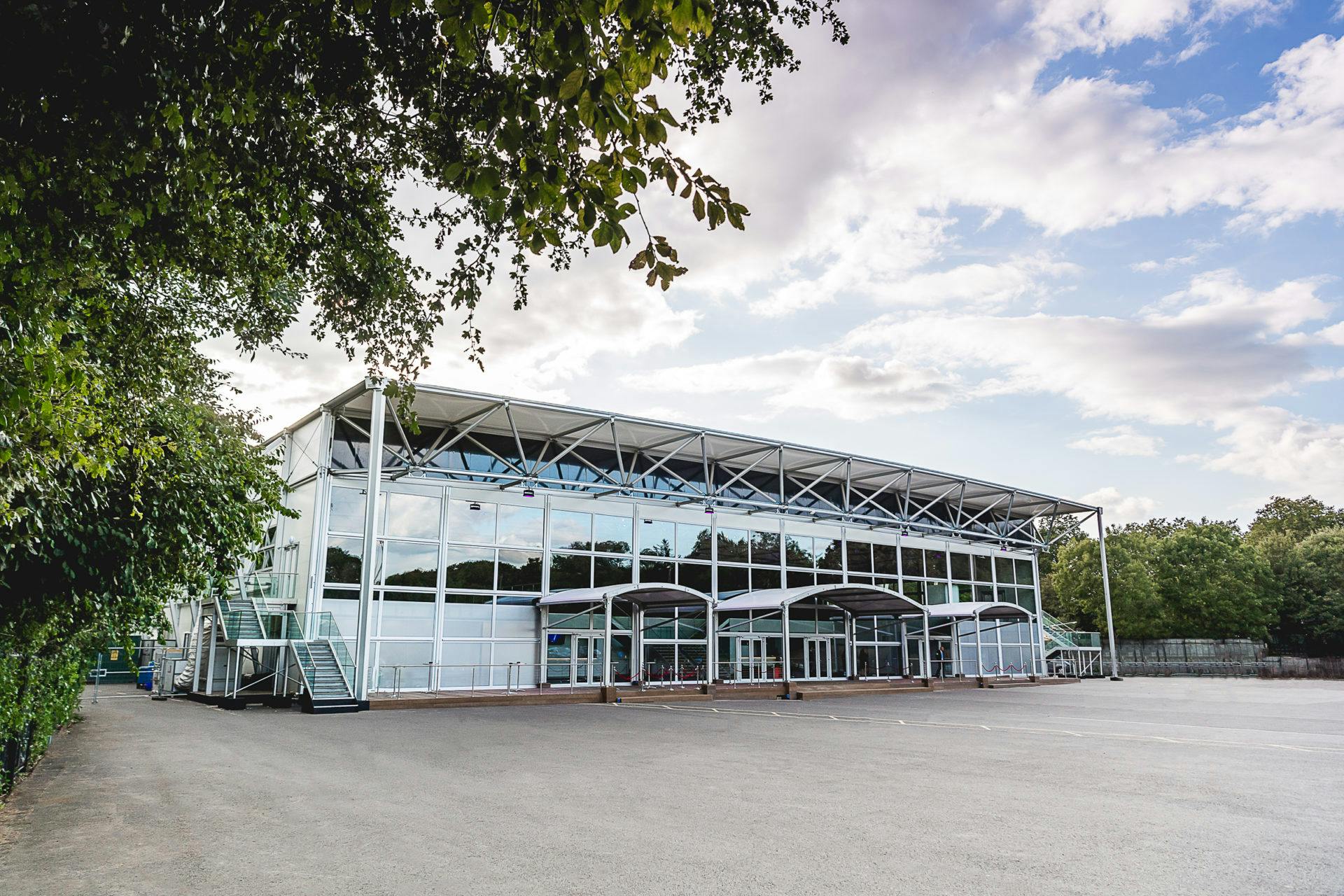 Modern event venue with glass facade, ideal for corporate and social gatherings.