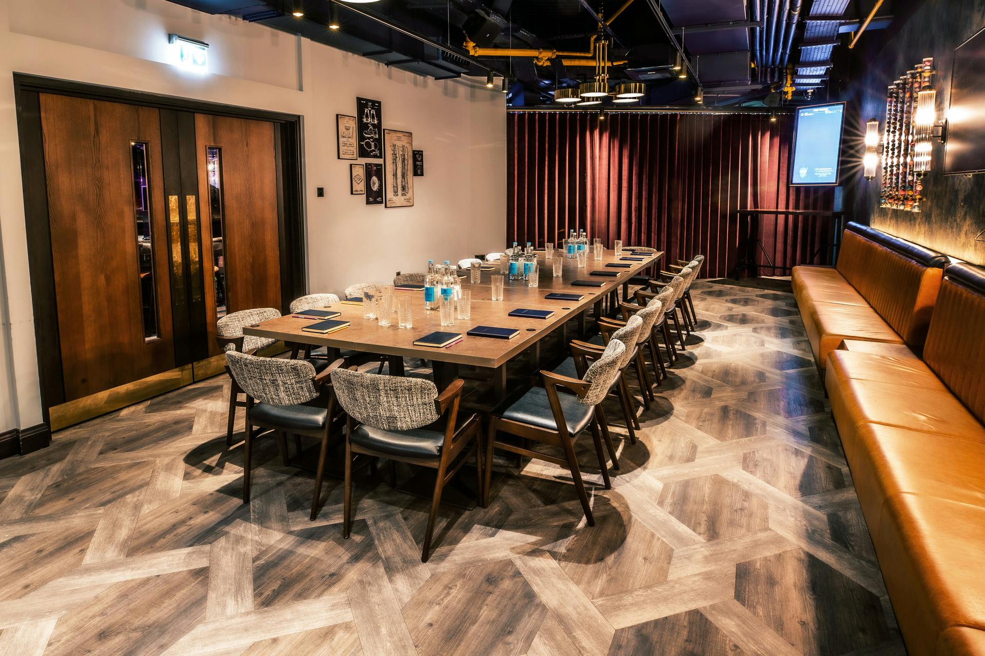 Exclusive meeting room at Puttshack Watford for corporate events, featuring elegant table setup.
