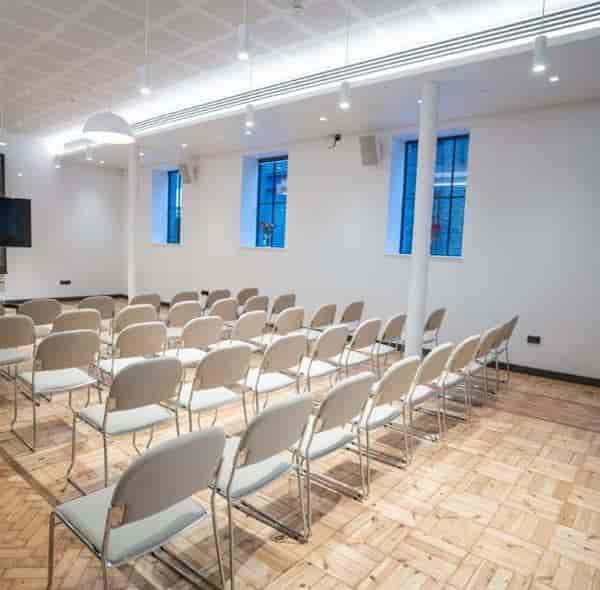 Wesleyan event space in Camden Town, bright minimalist design for seminars and presentations.