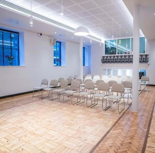 Versatile Wesleyan event space with natural light, ideal for workshops and seminars.