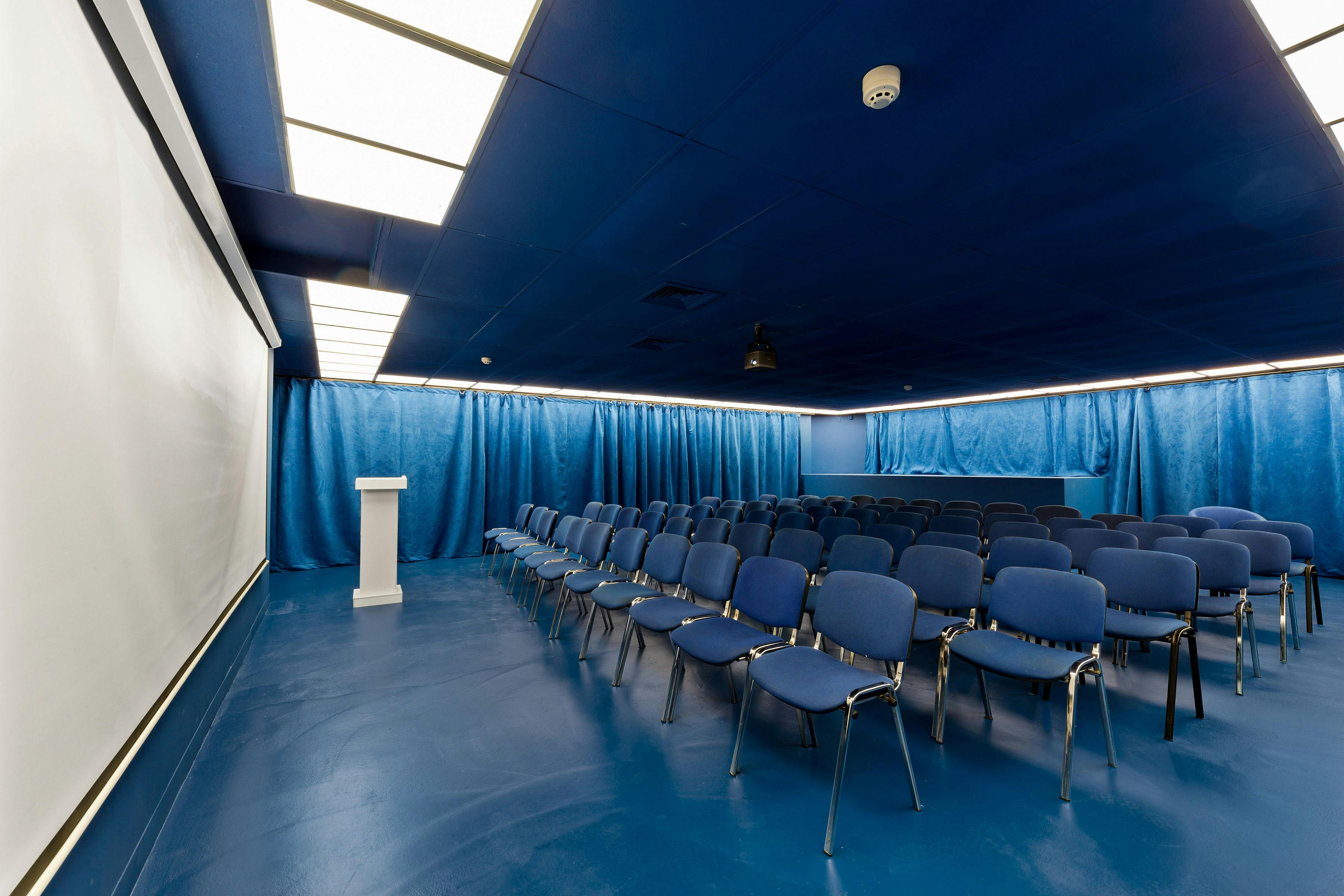 Modern blue meeting room for workshops and seminars at Proposition Studios.