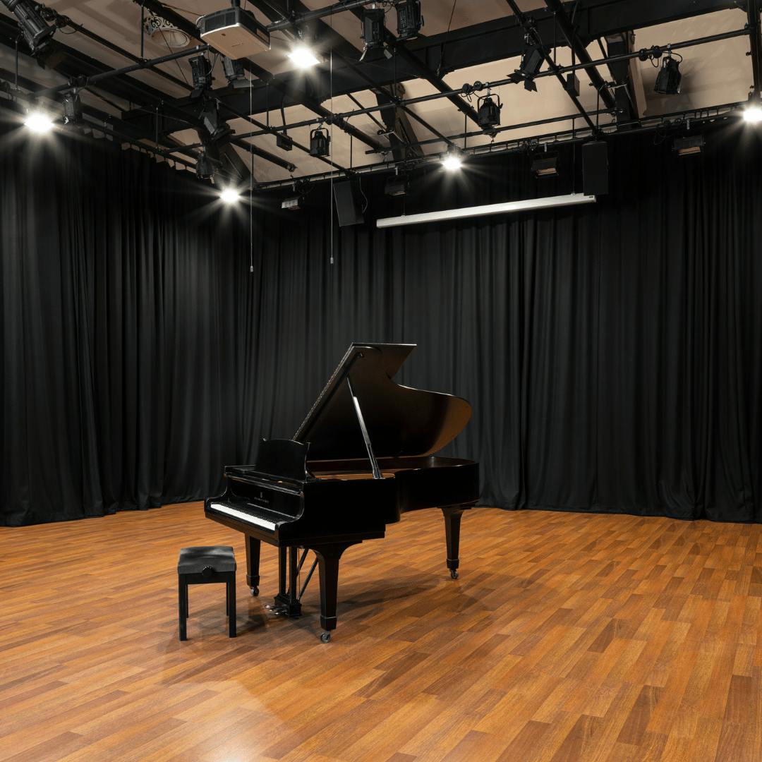 Sleek grand piano in elegant venue for upscale concerts and recitals.