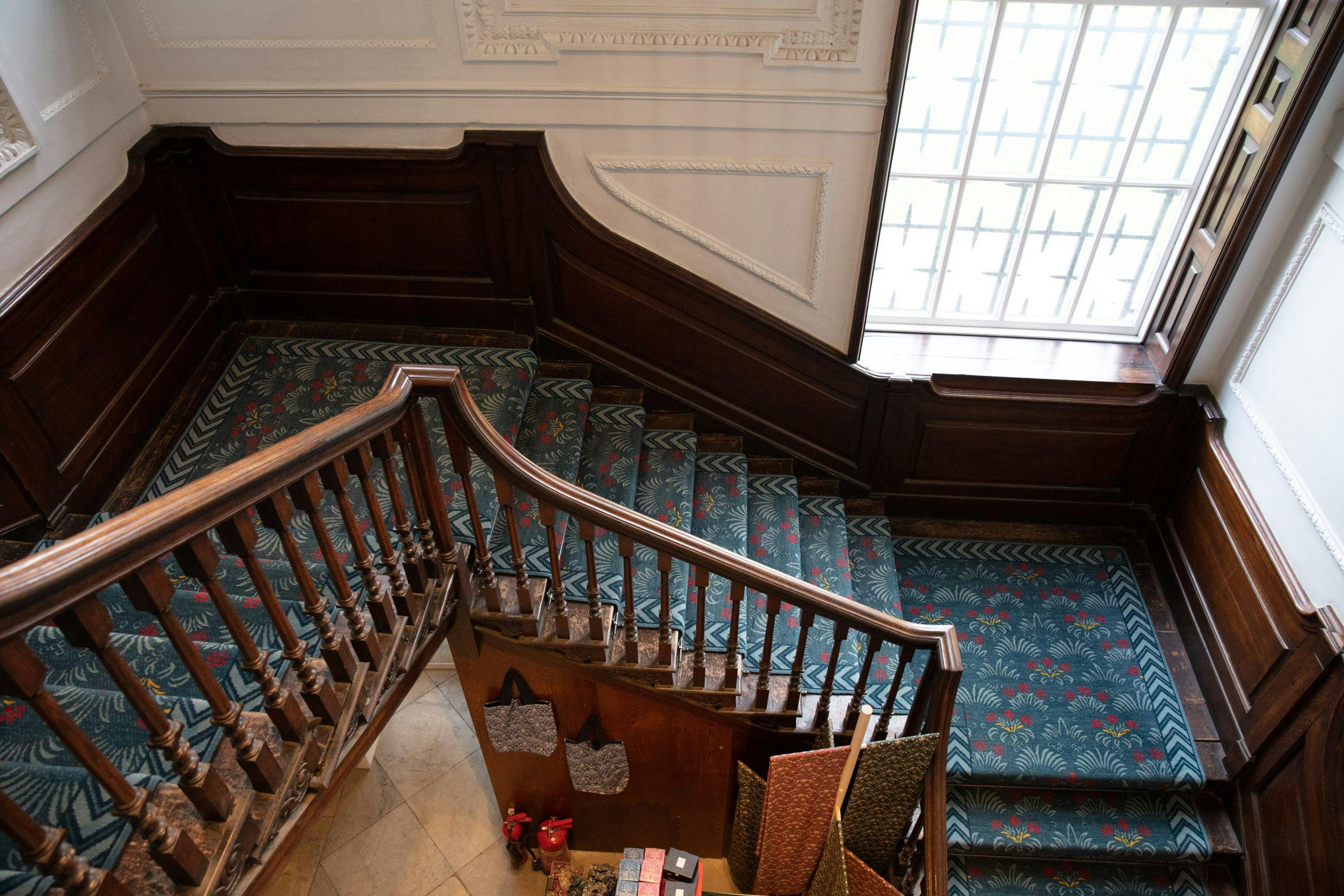 Elegant staircase with wooden railings at William Morris Gallery for upscale events.