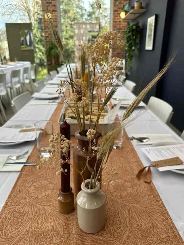 Elegant table setting with dried florals for an intimate event at William Morris Gallery.