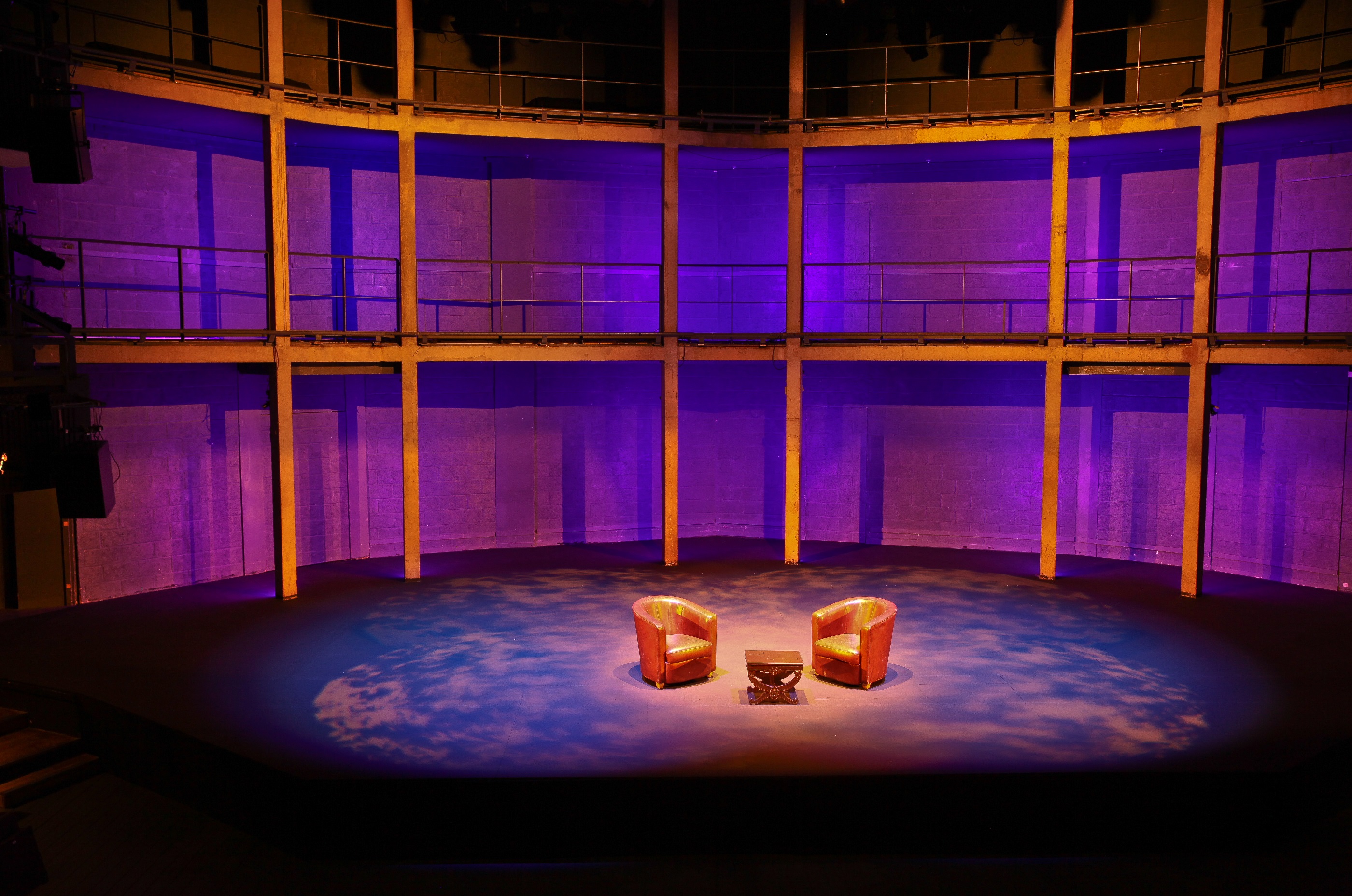 Main Auditorium at Rose Theatre: intimate event space with purple lighting and chairs.