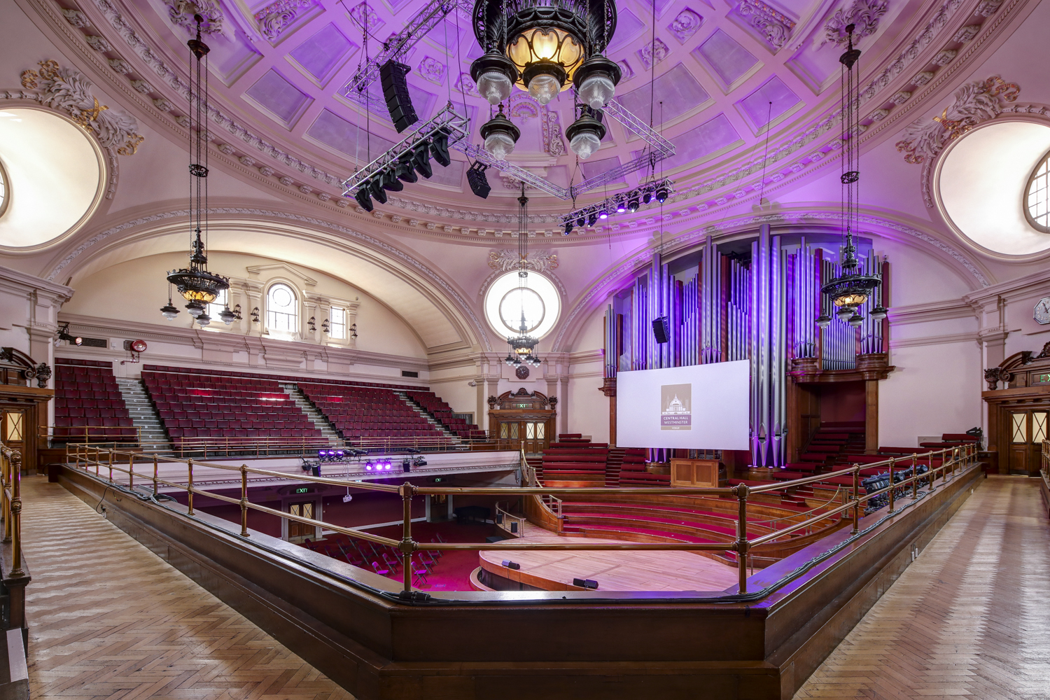 Great Hall Westminster with tiered seating, ideal for conferences and performances. - Banner