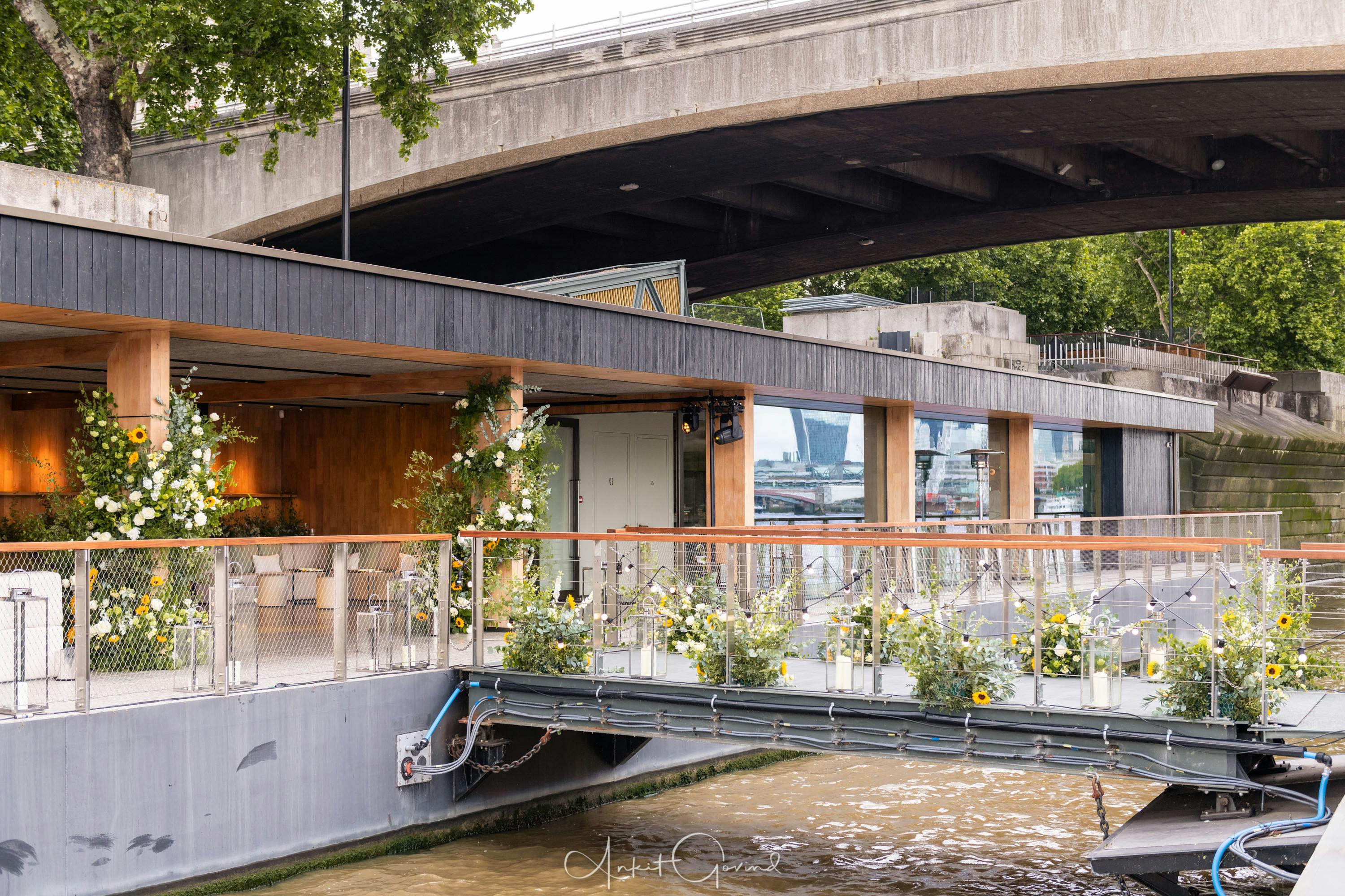 Stylish waterfront venue with large windows for events at Woods Quay, London.