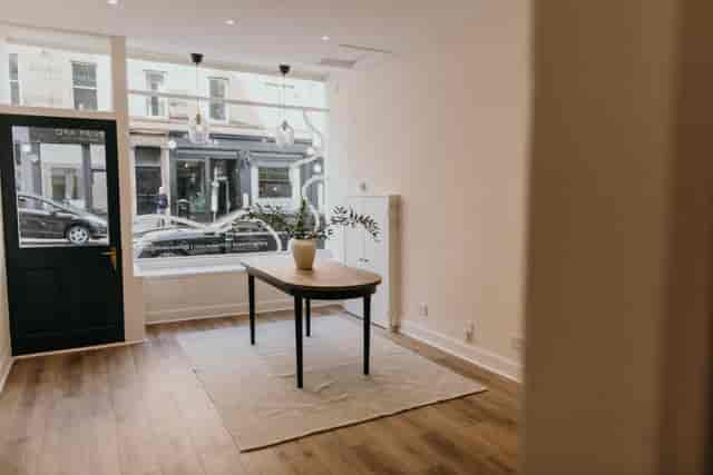 Versatile event space with natural light, ideal for meetings and workshops.