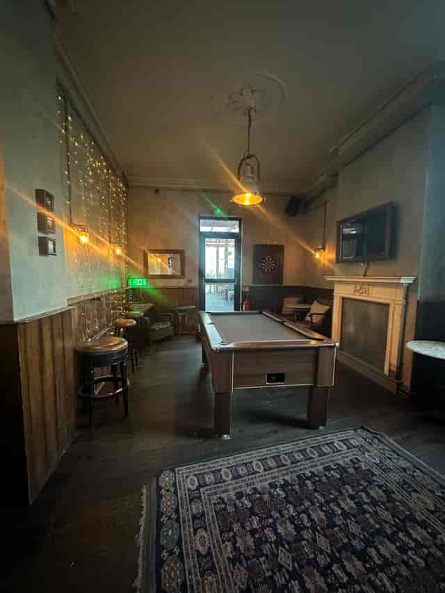 Cozy billiard room with pool table, perfect for networking and team-building events.