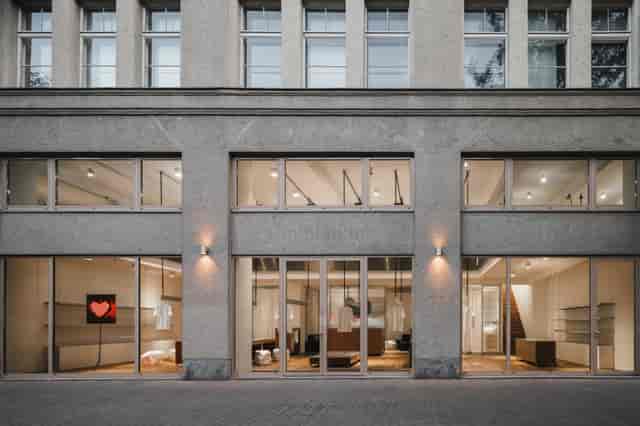 Modern venue with large glass windows, perfect for corporate meetings and social events.