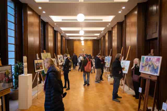 Art exhibition gallery at Hornsey Town Hall featuring wooden easels for networking events.