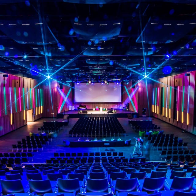 Spacious Gartensaal conference hall with vibrant lighting for events and presentations.