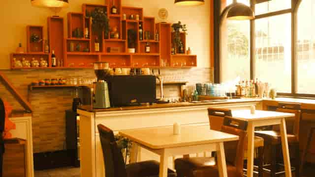 Cozy café in The Hub, warm lighting for networking events and casual meetings.