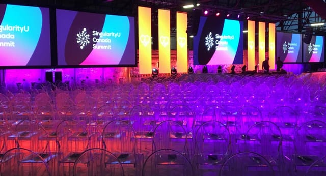 CRH Gallery event space with modern acrylic chairs for a vibrant summit setup.