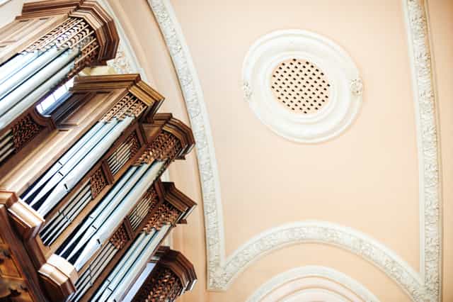 Great Hall at UCS Venues with intricate ceiling and organ, perfect for elegant events.