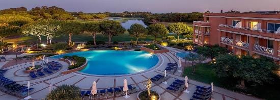 Serene outdoor event space with pool at Quinta Da Marinha Hotel, ideal for gatherings.