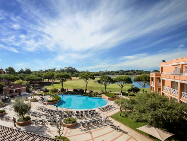 Outdoor event venue with pool and greenery at Quinta Da Marinha Hotel.
