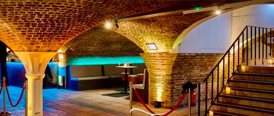 Stylish underground venue with exposed brick arches for private parties and corporate events.