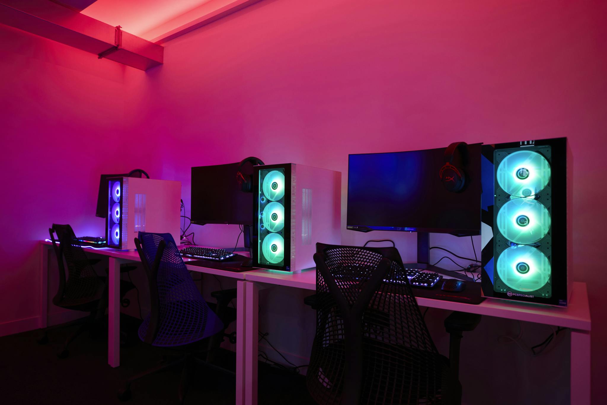 Modern gaming venue with RGB PCs, ideal for esports tournaments and tech events.