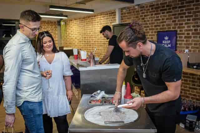 Interactive dessert event at EC1 Campus with rolled ice cream preparation.