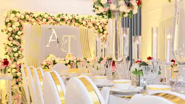 Elegant wedding venue with floral decor and gold accents at S3 Royal Arsenal Events.