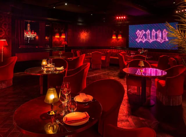 Stylish event space at Hotel Sofia Barcelona with rich red decor for upscale gatherings.