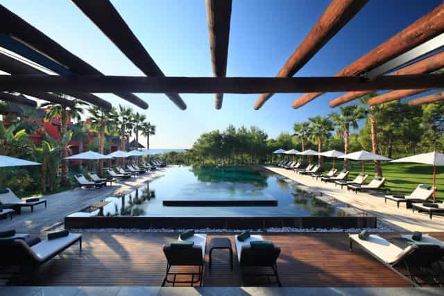 Outdoor venue at Asia Gardens Hotel with serene pool, ideal for upscale events and receptions.