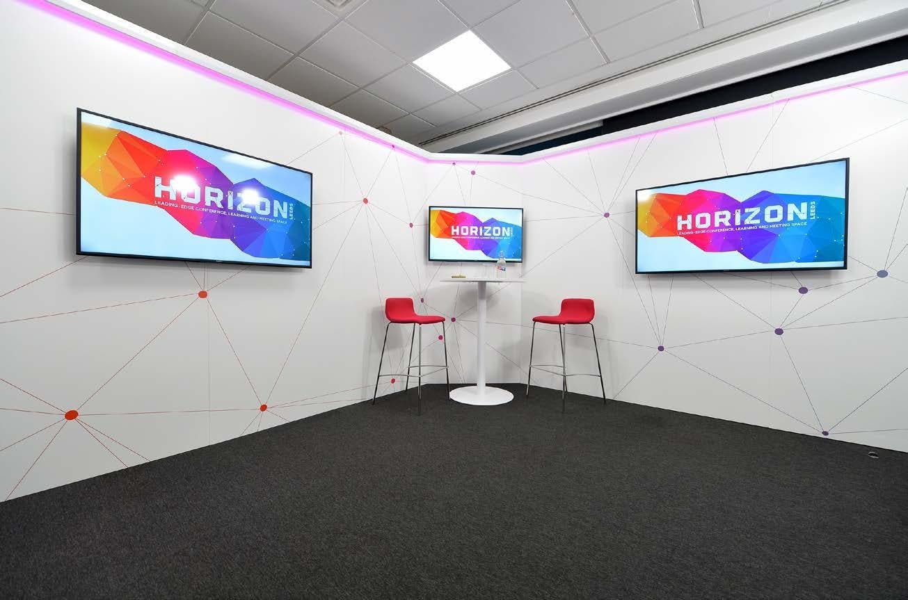 Modern event space in Horizon Leeds with vibrant branding, ideal for workshops and conferences.