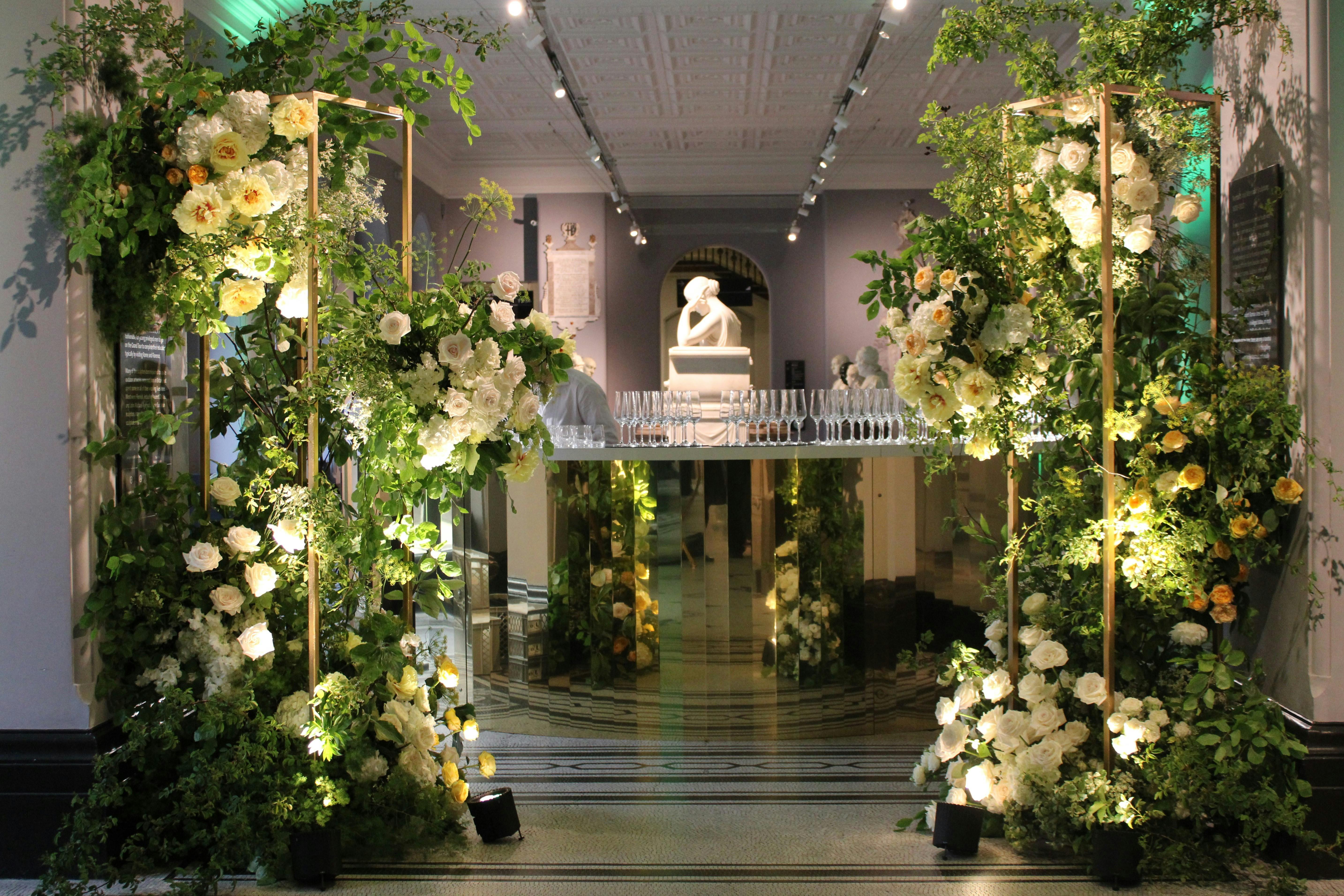 Elegant floral entrance at Hintze Sculpture Galleries for upscale weddings and events.