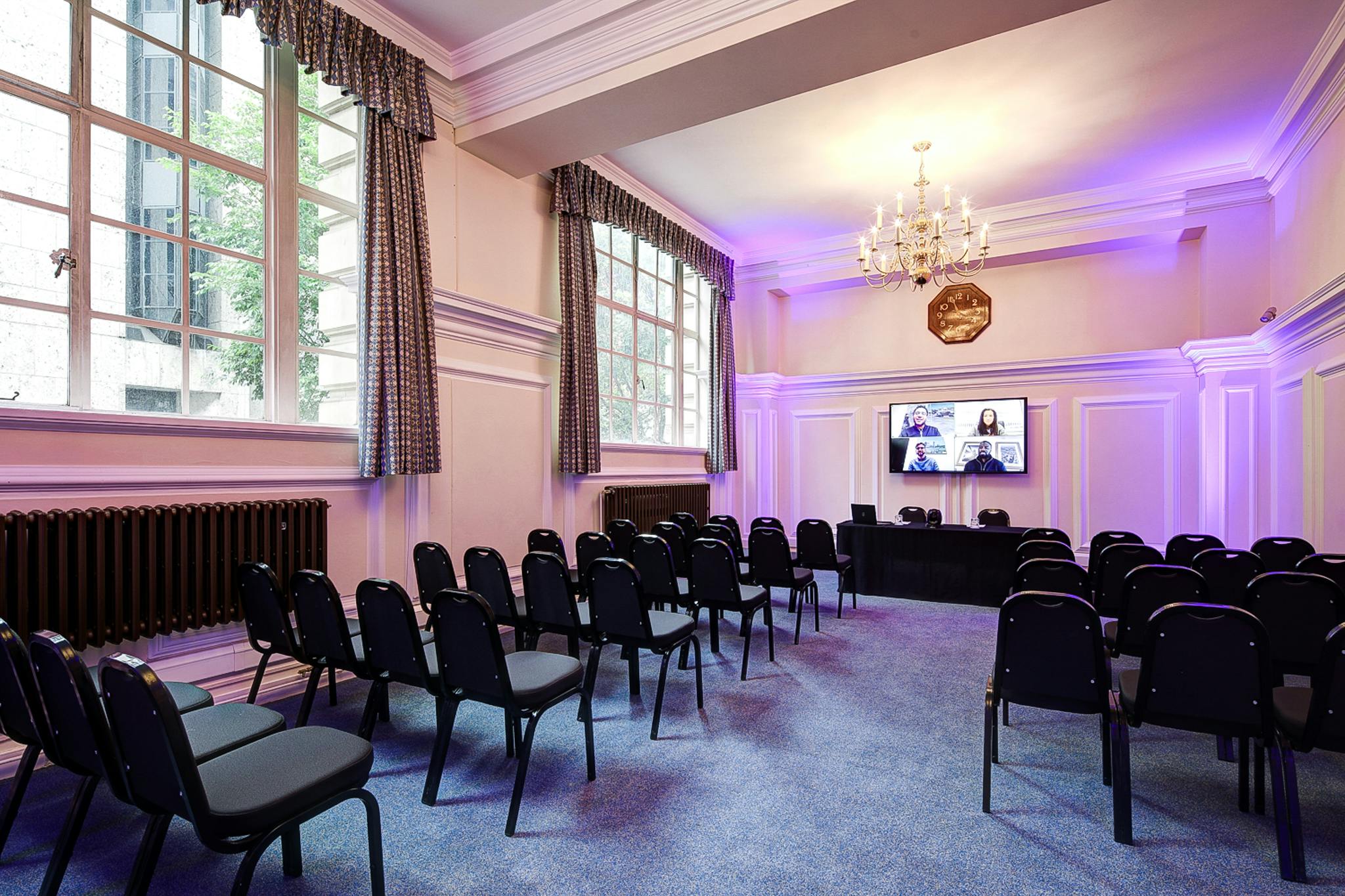 Dinsdale Young in Central Hall Westminster, hybrid event space with elegant decor.