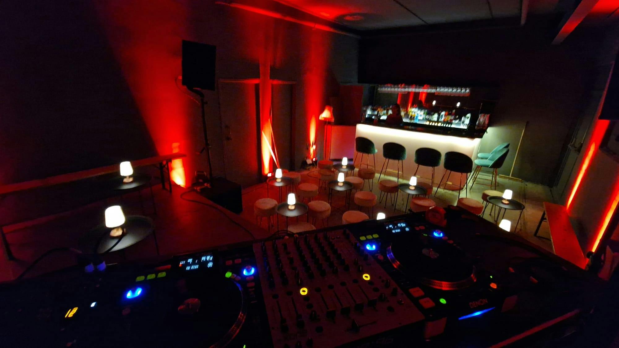 Stylish event space with red lighting for intimate gatherings and cocktail receptions.