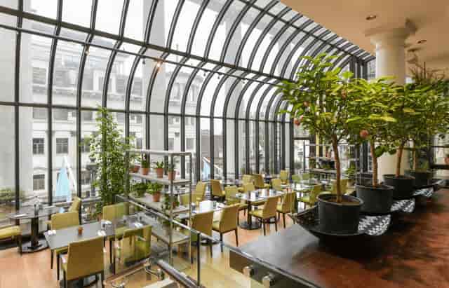Modern restaurant venue with large windows, perfect for corporate and social events.