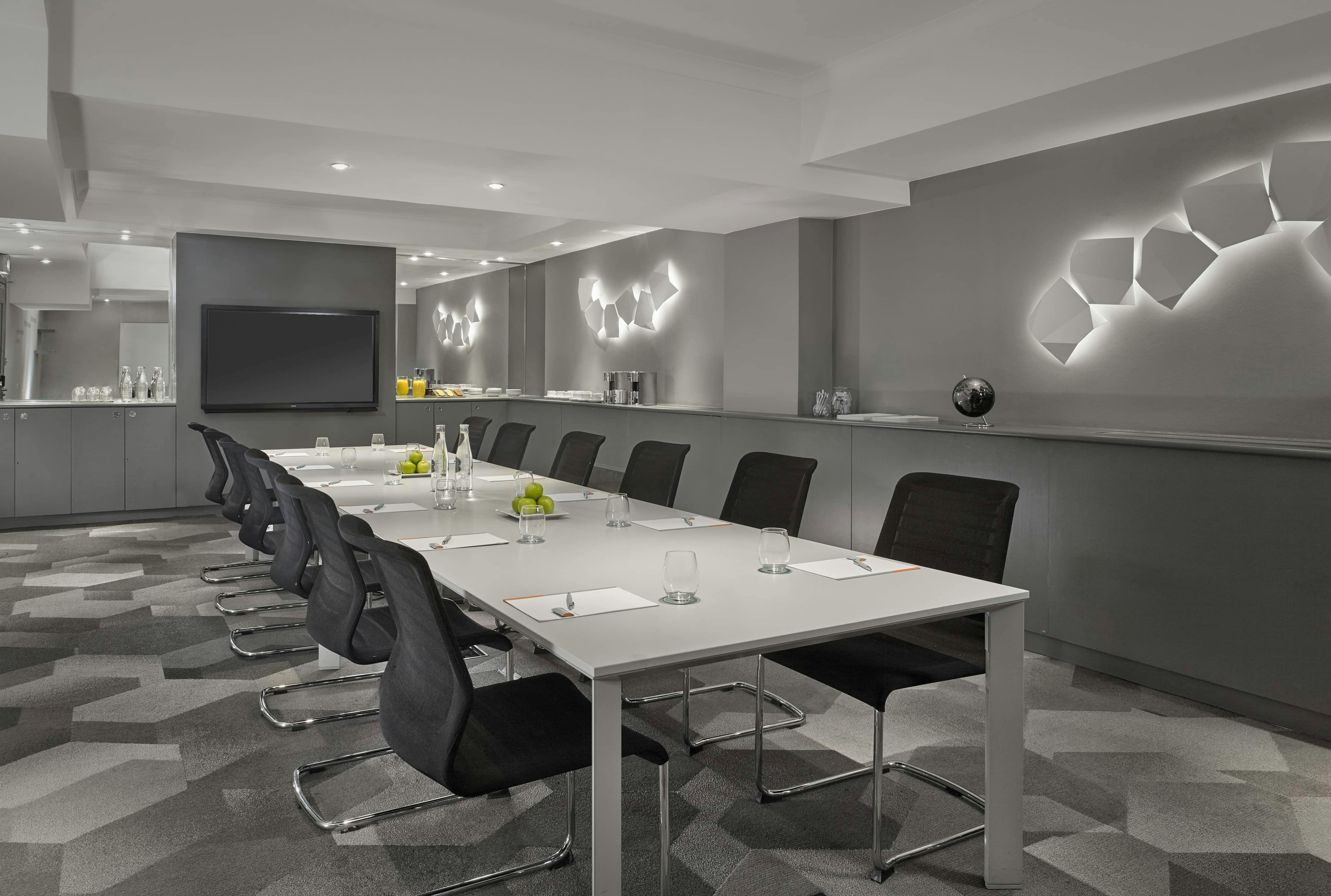 Modern Mayfair Suite meeting room with ergonomic chairs for corporate events.