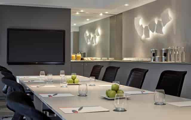 Modern Mayfair Suite meeting room with sleek table, ideal for corporate events.