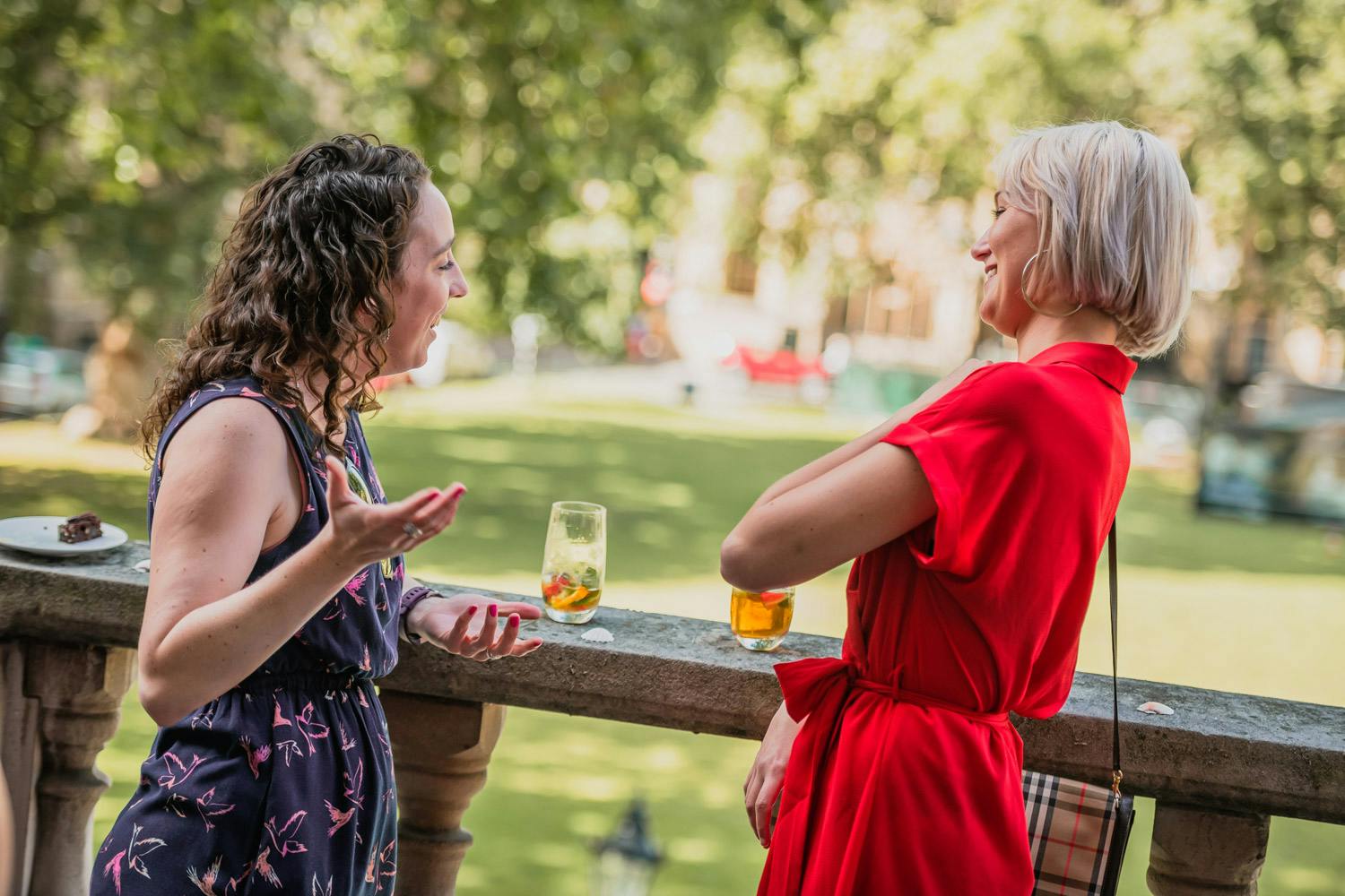 Outdoor networking event at Church House, attendees in casual attire enjoying drinks.