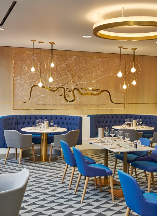 Stylish dining area at The Royal East, London Stadium for intimate events and meetings.