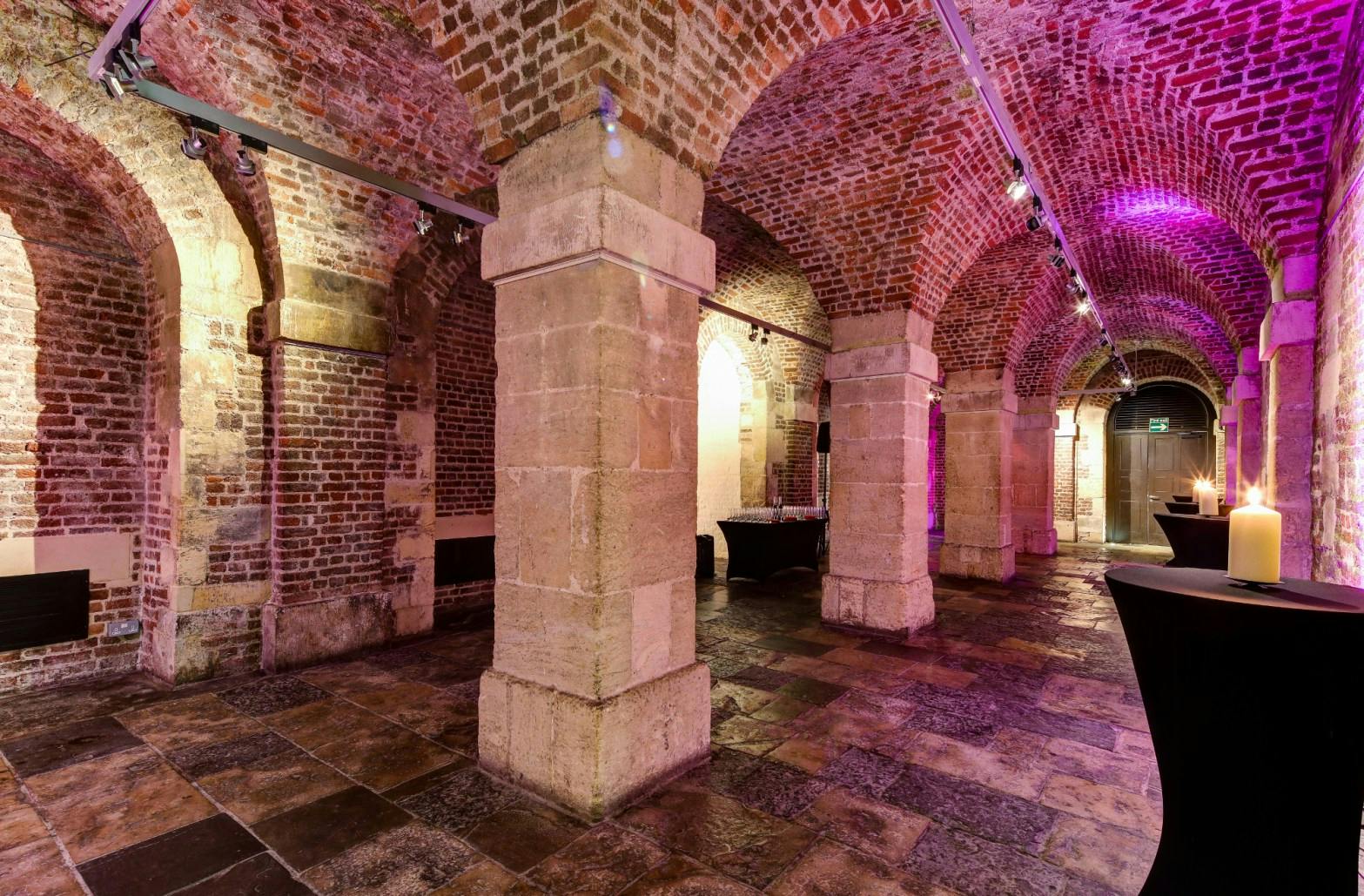 Historic event space with exposed brick arches at St Martin-in-the-Fields.