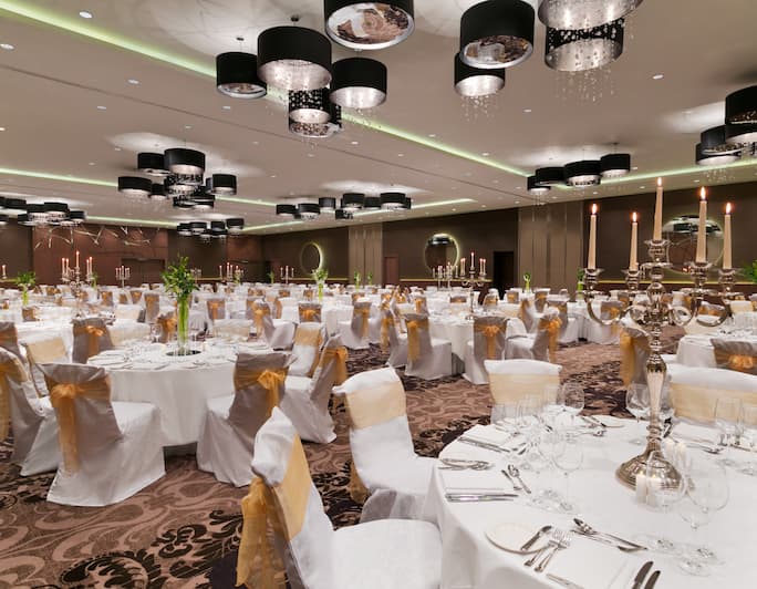 Elegant banquet hall at Hilton London Wembley, ideal for formal events and receptions. - Banner