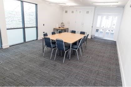 Sapphire Suite meeting room with large table, ideal for workshops and team meetings.