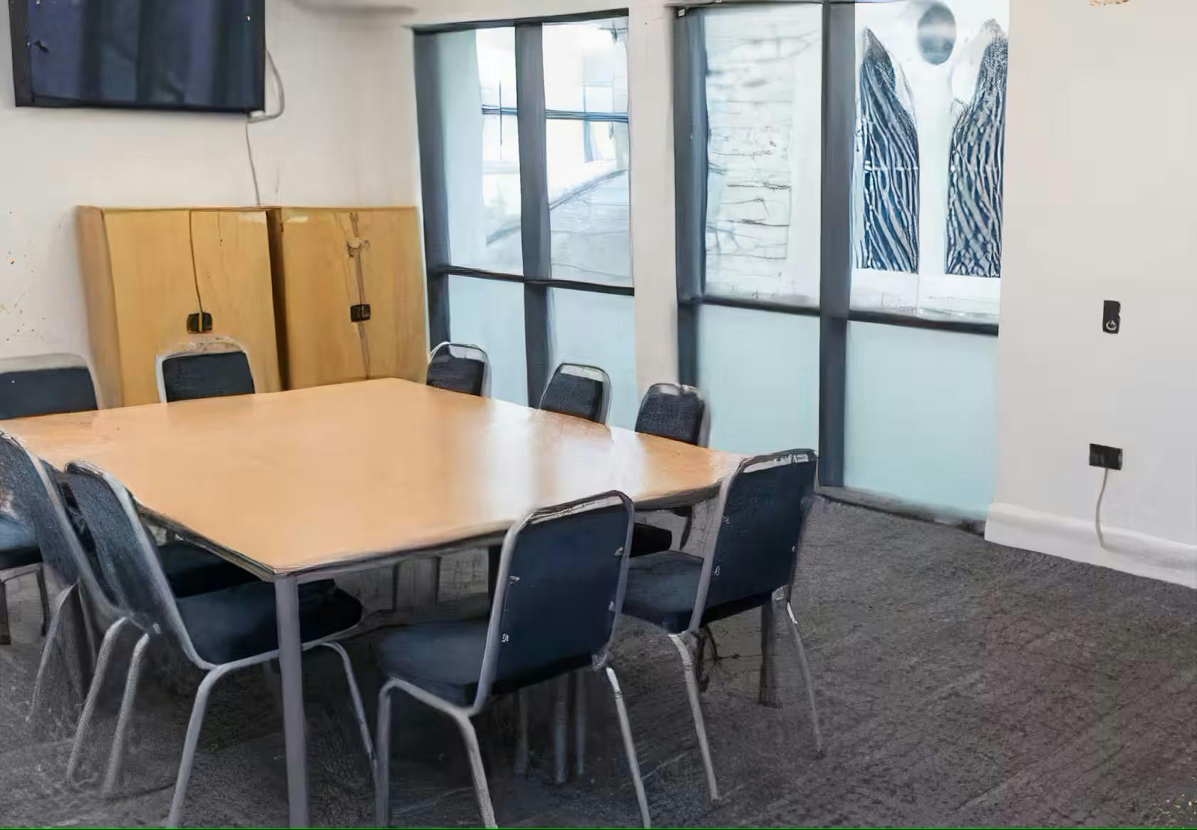 Sapphire Suite meeting room with large table, ideal for events and discussions.