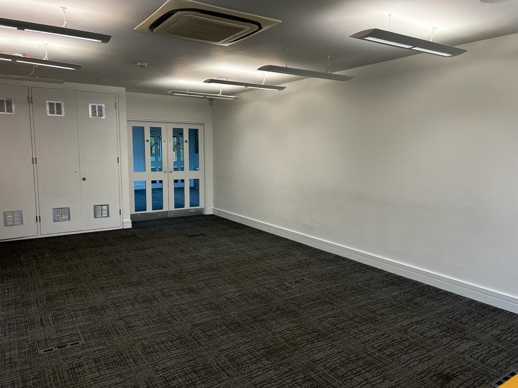 Sapphire Suite meeting room with natural light, ideal for workshops and gatherings.