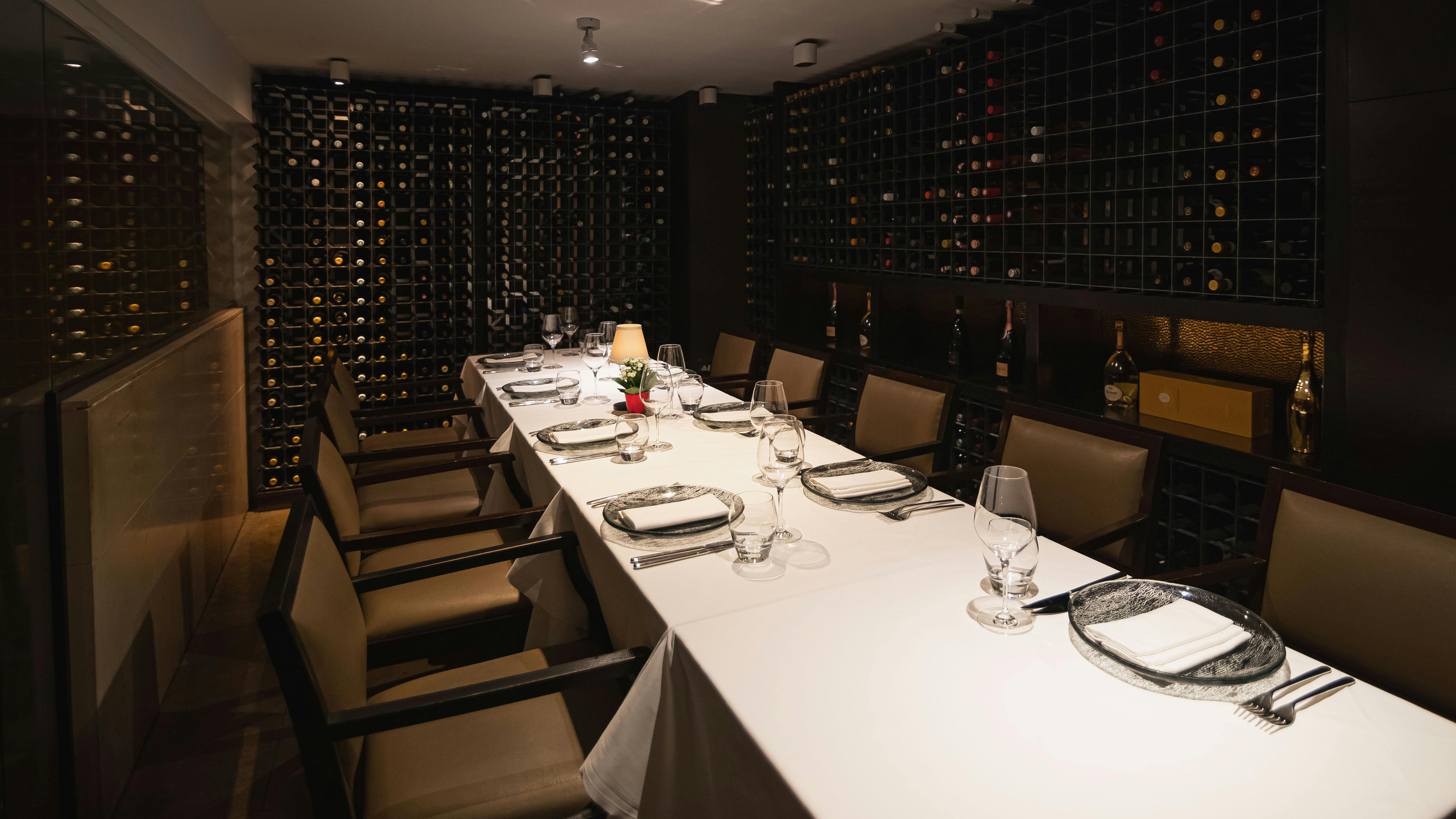 Elegant private dining room with wine cellar, perfect for corporate meetings and wine tastings.