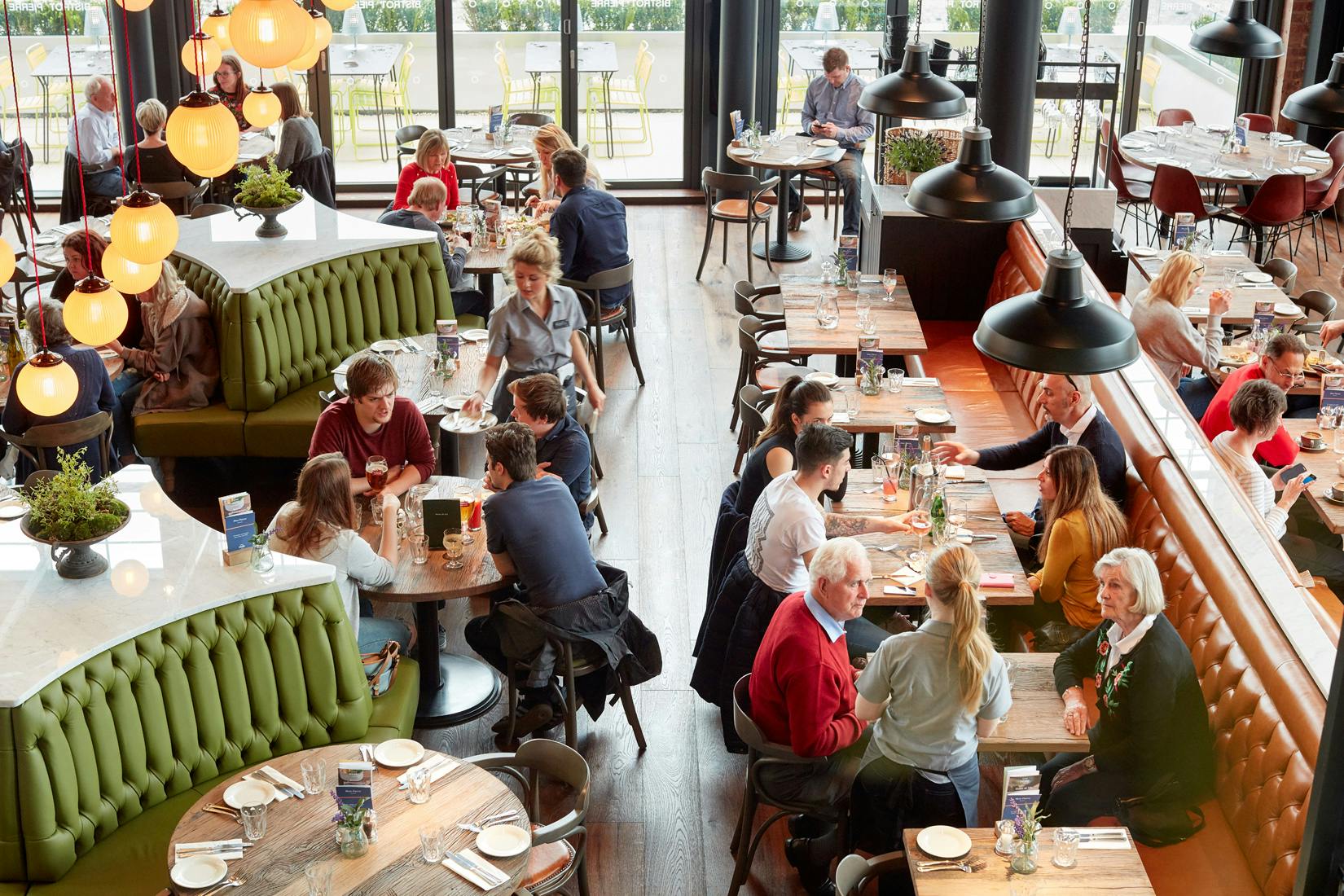 Vibrant Tivoli Room at Bistrot Pierre, ideal for networking events and casual meetings.