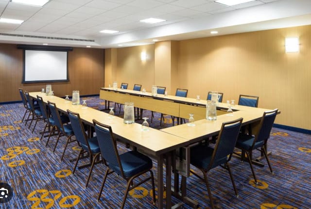 Liberty Hall meeting room with long table, ideal for professional gatherings and presentations.