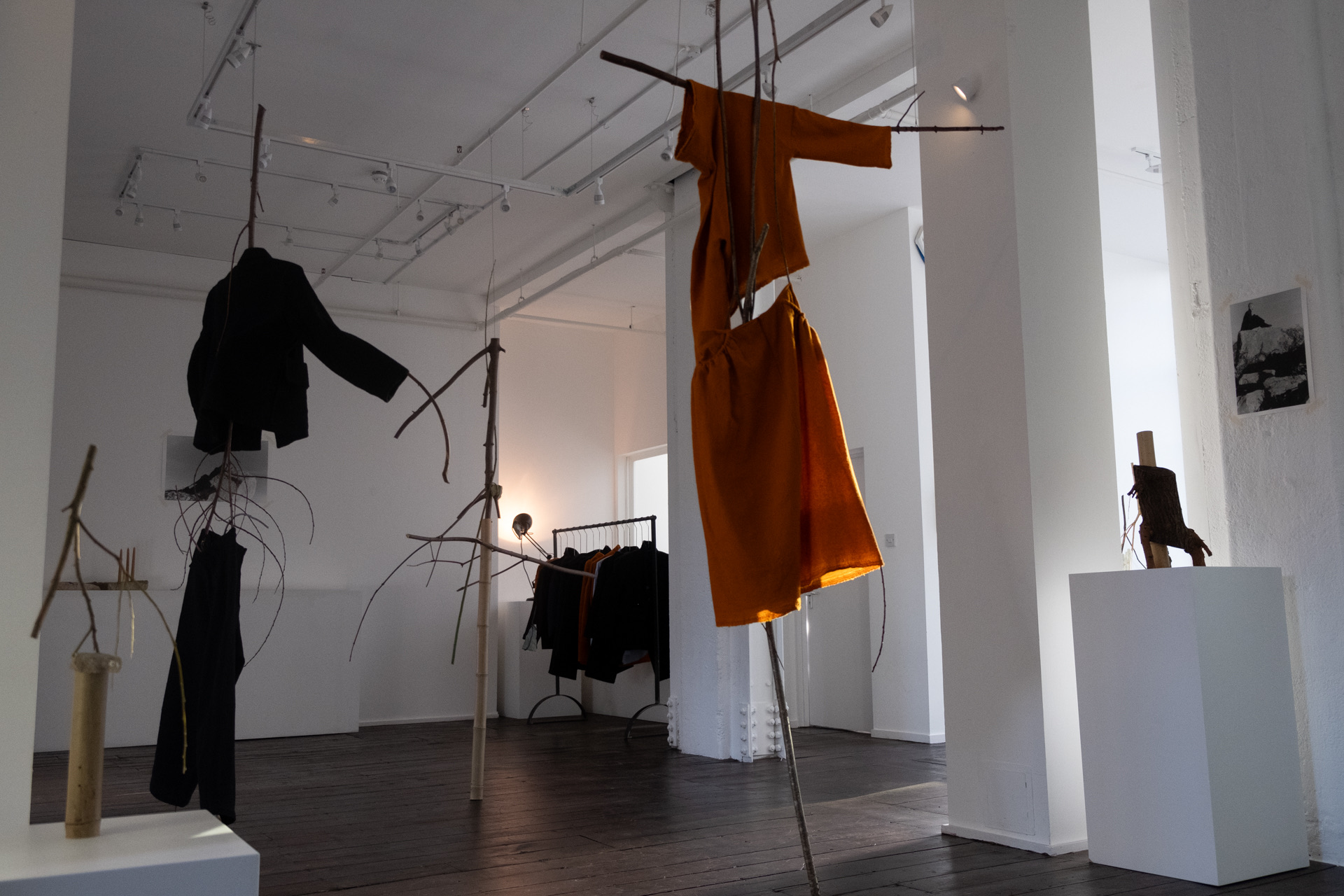 Minimalist installation with suspended garments for fashion events and art exhibitions. - Banner